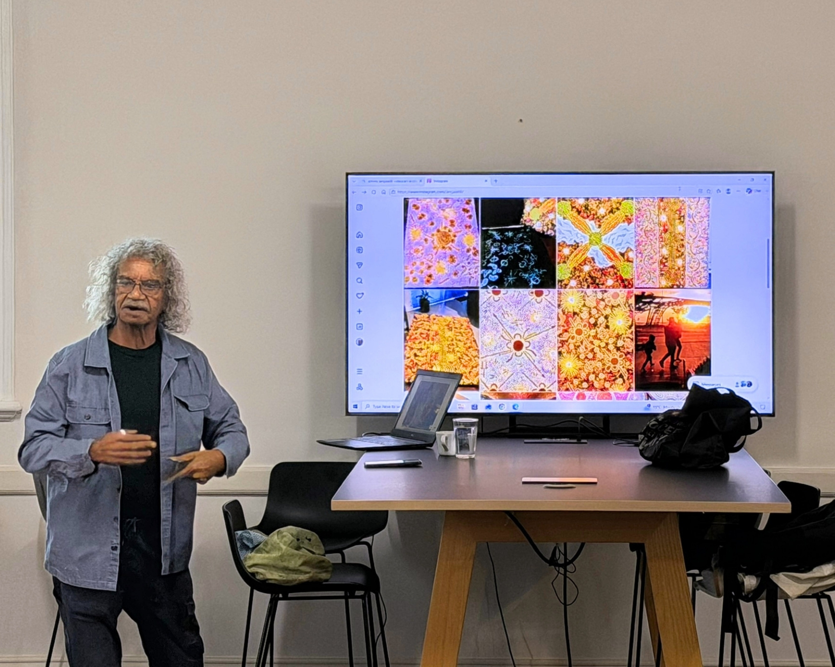 Plus Studio WA team painting with Creative Native, led by artist Johnny Jangala